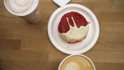 Coffee on the table, red cake or croissant in white chocolate Stock Footage 290213376