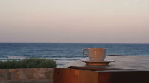 Coffee. On the table there is coffee in the background view of the sea Stock Footage 107180422