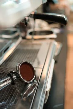 Coffee tamper to coffee machine Stock Photos