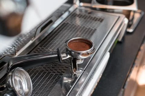 Coffee tamper to coffee machine Stock Photos