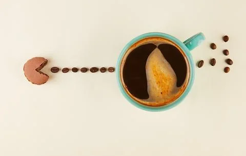 The Coffee Taste Macaron eats coffee beans with an open mouth, just like in a Stock Photos