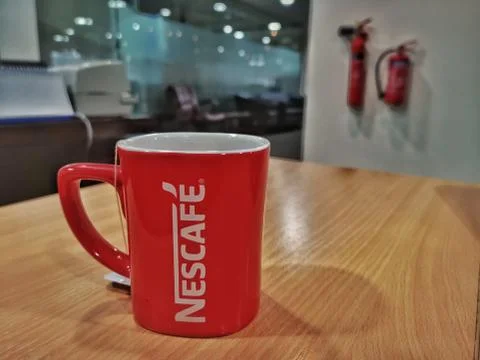 Coffee tea mug on table interior of office indoor Stock Photos