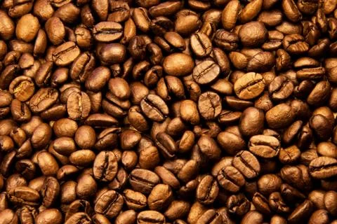 Coffee texture. Roasted coffee beans as background wallpaper. Beautiful arabi Stock Photos