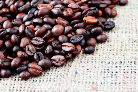 Coffee texture. Roasted coffee beans as background wallpaper. Beautiful arabi Stock Photos