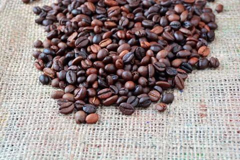 Coffee texture. Roasted coffee beans as background wallpaper. Beautiful arabi Stock Photos