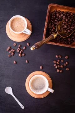 Coffee theme. Flat lay. Hot cups of coffee and plate with coffee beans. 스톡 사진