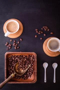Coffee theme. Flat lay. Hot cups of coffee and plate with coffee beans. Stock Photos