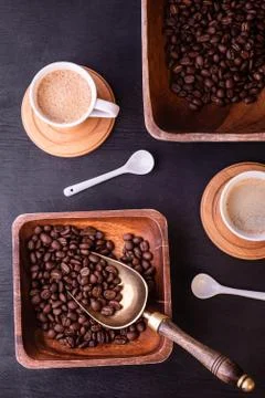 Coffee theme. Flat lay. Hot cups of coffee and plate with coffee beans. 스톡 사진