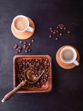 Coffee theme. Flat lay. Hot cups of coffee and plate with coffee beans. Foto stock
