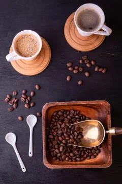 Coffee theme. Flat lay. Hot cups of coffee and plate with coffee beans. Stock Photos