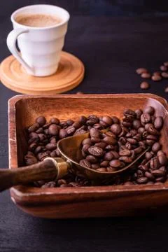 Coffee theme. Hot cups of coffee and plate with coffee beans. Stock Photos