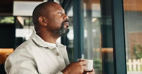 Coffee, thinking and window with black man in home for inspiration, memories or Stock Photos