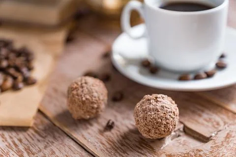 Coffee time break. Cup of freshly breved turk coffee, chocolate balls and b.. Stock Photos