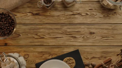 Coffee time flat lay view. Female hands thoughtfully holding and twisting cup Stock Footage 137090887