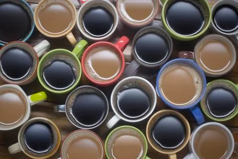 Coffee time - many cups of coffee on wooden table good background for text or Stock Photos