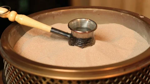 Coffee Turk heats up in the sand Stock Footage 158177965