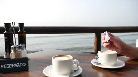 Coffee for two in a cafe on the beach. Vídeos de archivo 68954970