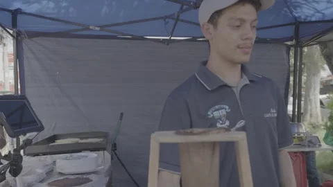 A coffee vendor preparing traditional coffee in San José, Costa Rica Stock Footage 344342888