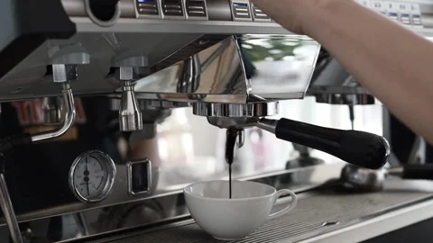 Coffee water flows from the coffee maker, Coffee press with water pressure pr Stock Footage 143988838
