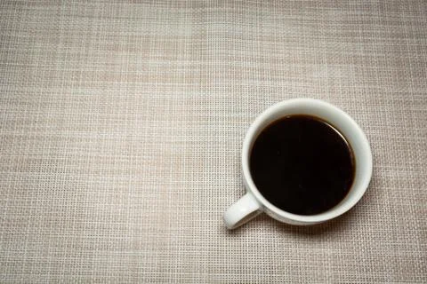 Coffee in a white cup on a light background Stock Photos