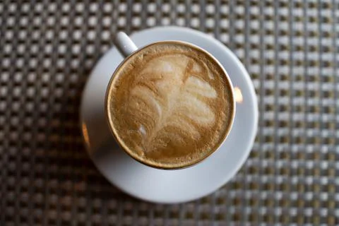 Coffee in a white cup on the table. Stock Photos