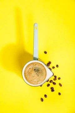 Coffee on yellow background Stock Photos