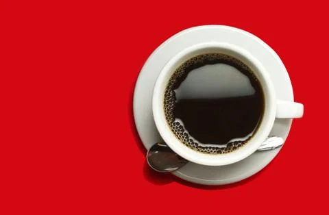 Coffeecup with Coffee on a red background Stock Photos
