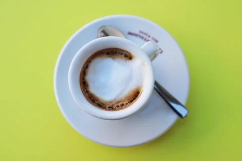 Coffeecup on a green table Stock Photos