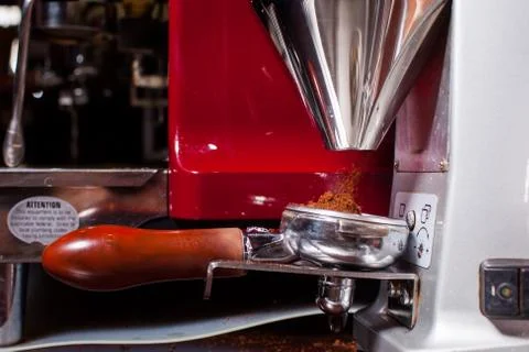 Coffeemachine pouring grind coffee. Close up. Stock-Fotos
