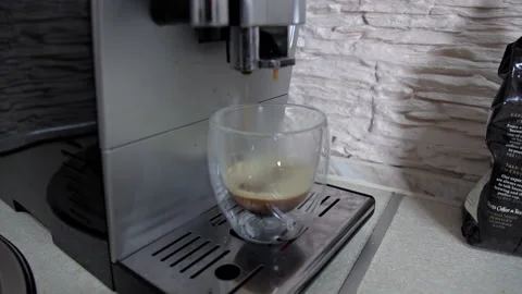 Coffeemaker pouring coffee into a cup. A close-up shot Stock-Footage 103491273