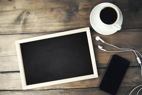 Coffee,phone and  photo frames Stock Photos