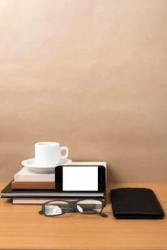 Coffee,phone,eyeglasses,stack of book and wallet 写真素材