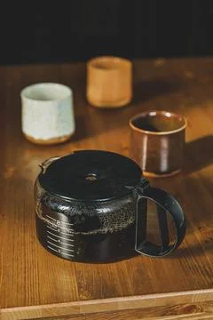 Coffepot with three cups Stock Photos