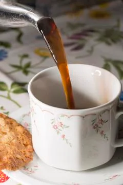 Coffey Pouring into Cup Stock Photos