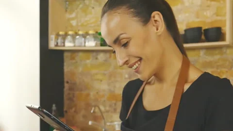 Cofffeeshop worker with ipad. Slow motion. Stock Footage 96371013