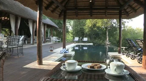 Coffie with rusks over looking pool Stock Footage 22774962