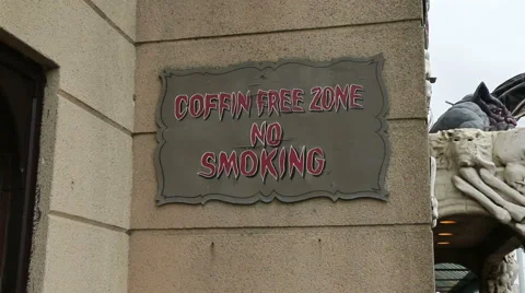 Coffin free zone cough no smoking wall sign Stock Footage 47893012