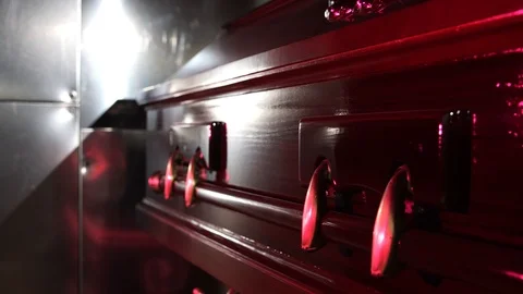 Coffin in front of cremation oven Stock Footage 113026338