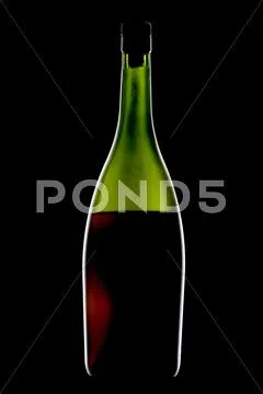 Cognac bottle on black Stock Photos