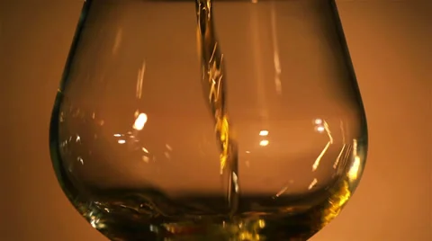 Cognac, brandy flows in a glass Stock Footage 34434306