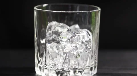 Cognac with ice 1 Stock Footage 58899565