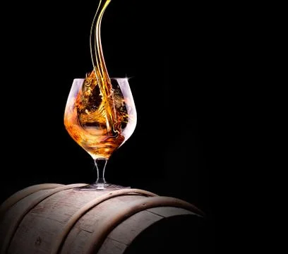 Cognac or brandy on a black Stock Photos