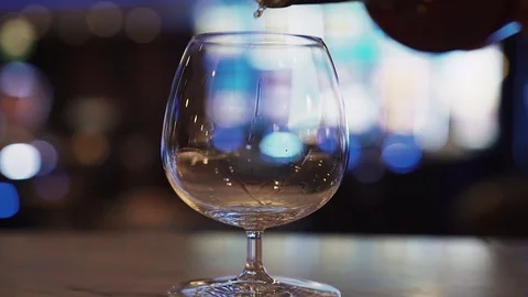 Cognac is poured into the glass Stock Footage 126545955