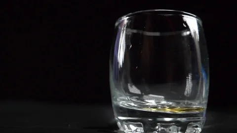 Cognac is poured into a stack Video stock 119283042
