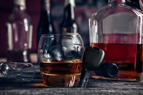 Cognac,car key and empty bottle Stock Photos