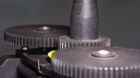 Cogs gears of forge-rolls turn by touching each other Stock-Footage 145009858