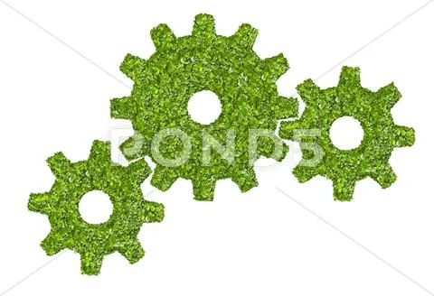 Cogs or gears from the green grass. Stock Photos