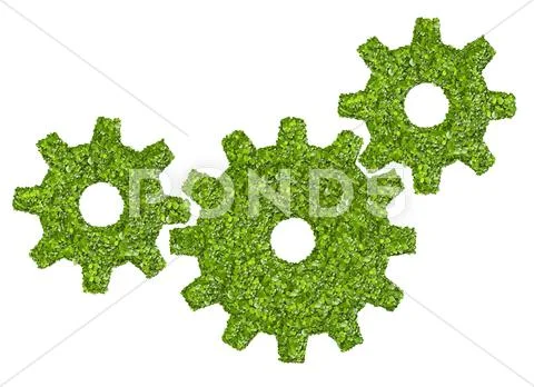 Cogs or gears from the green grass. Stock Photos