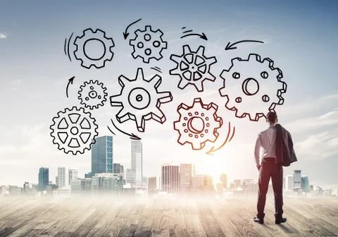 Cogwheel engine drawn on screen as symbol for teamwork and coope Stock Photos
