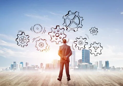 Cogwheel engine drawn on screen as symbol for teamwork and cooperation Stock Photos